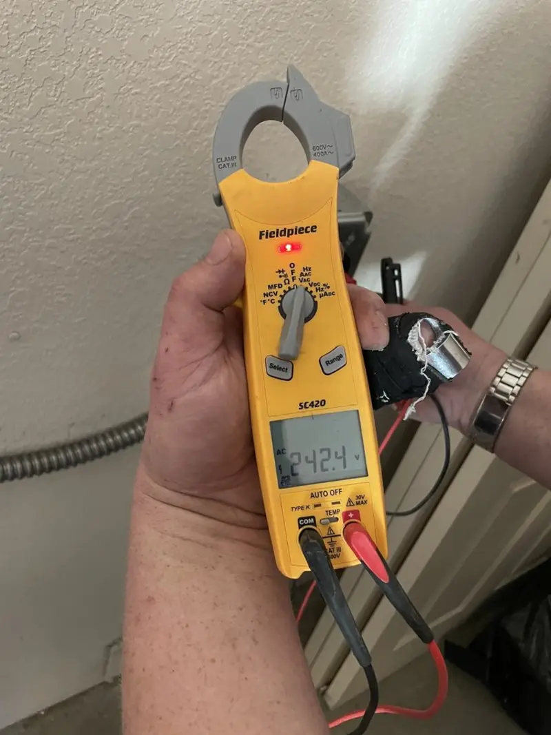 Voltage testing with clamp meter during Outlet Installation in La Villa